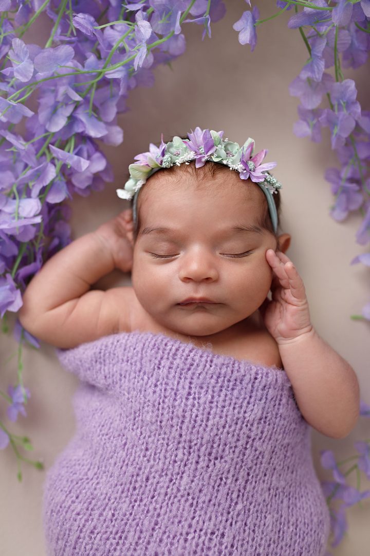 Sleeping newborn baby wrapped in a soft cream wrap — Studio Muffin, Tbilisi