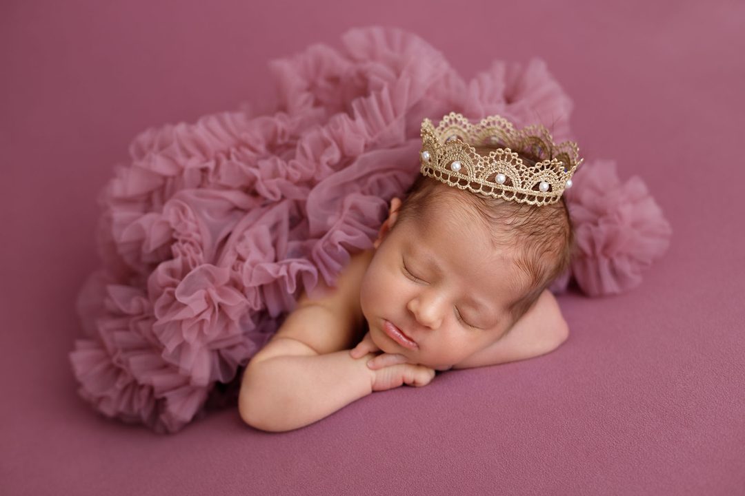 Peaceful newborn baby during a certified newborn photo session in Tbilisi