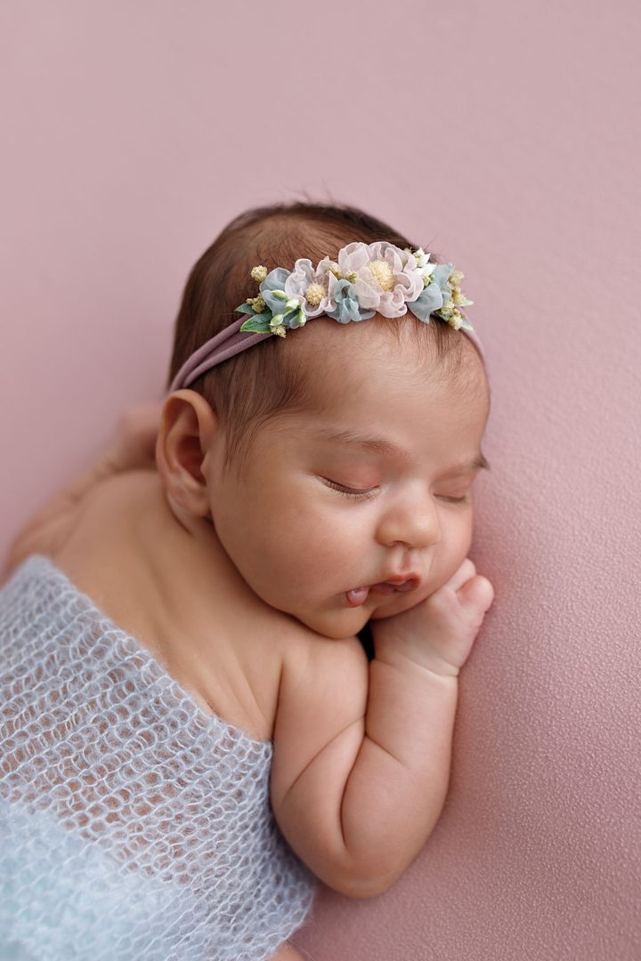 Soft pink-toned newborn portrait — premium studio session in Tbilisi